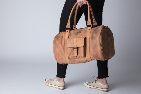 tan leather duffle bag