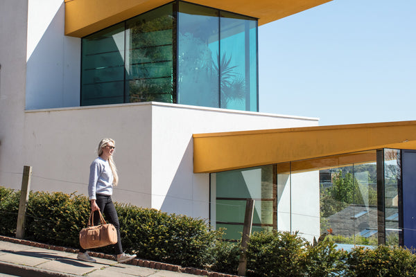 tan leather duffle bag